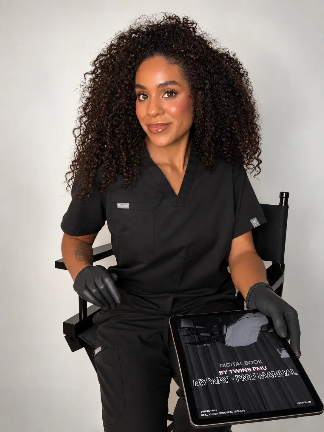 Juliana, TWINS PMU founder, holding the MY WAY PMU manual